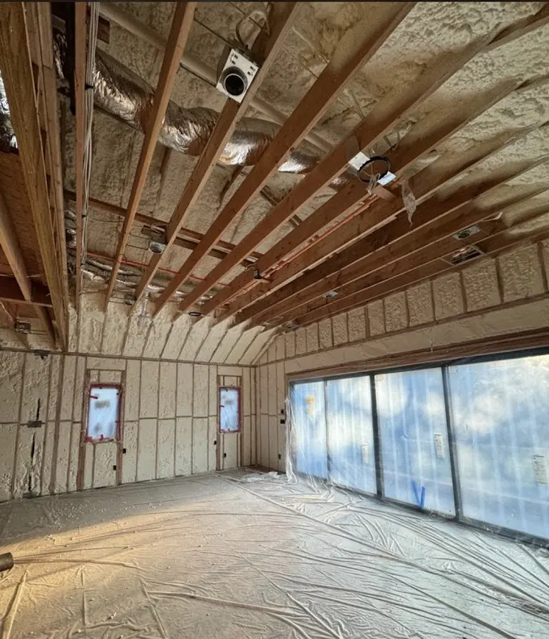 Interior walls and ceiling insulated with spray foam during new construction in Angier
